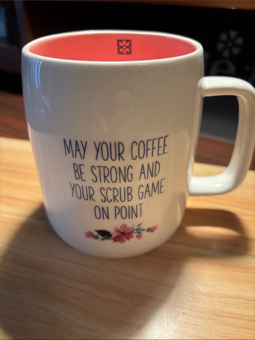 White Ceramic Mug with Pink Interior and Floral Detail, Motivational Nurse Quote